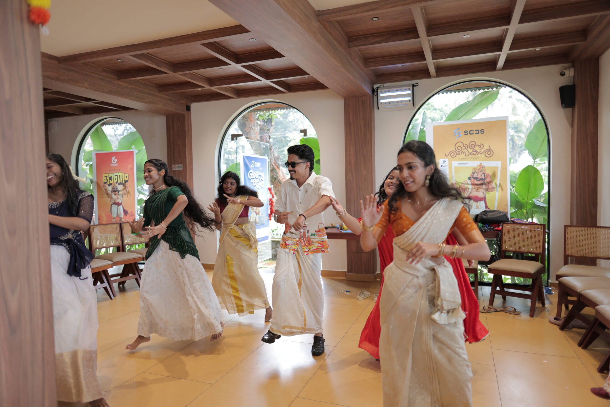 Employees dancing at the AiKHYAM 2K26 Onam celebration