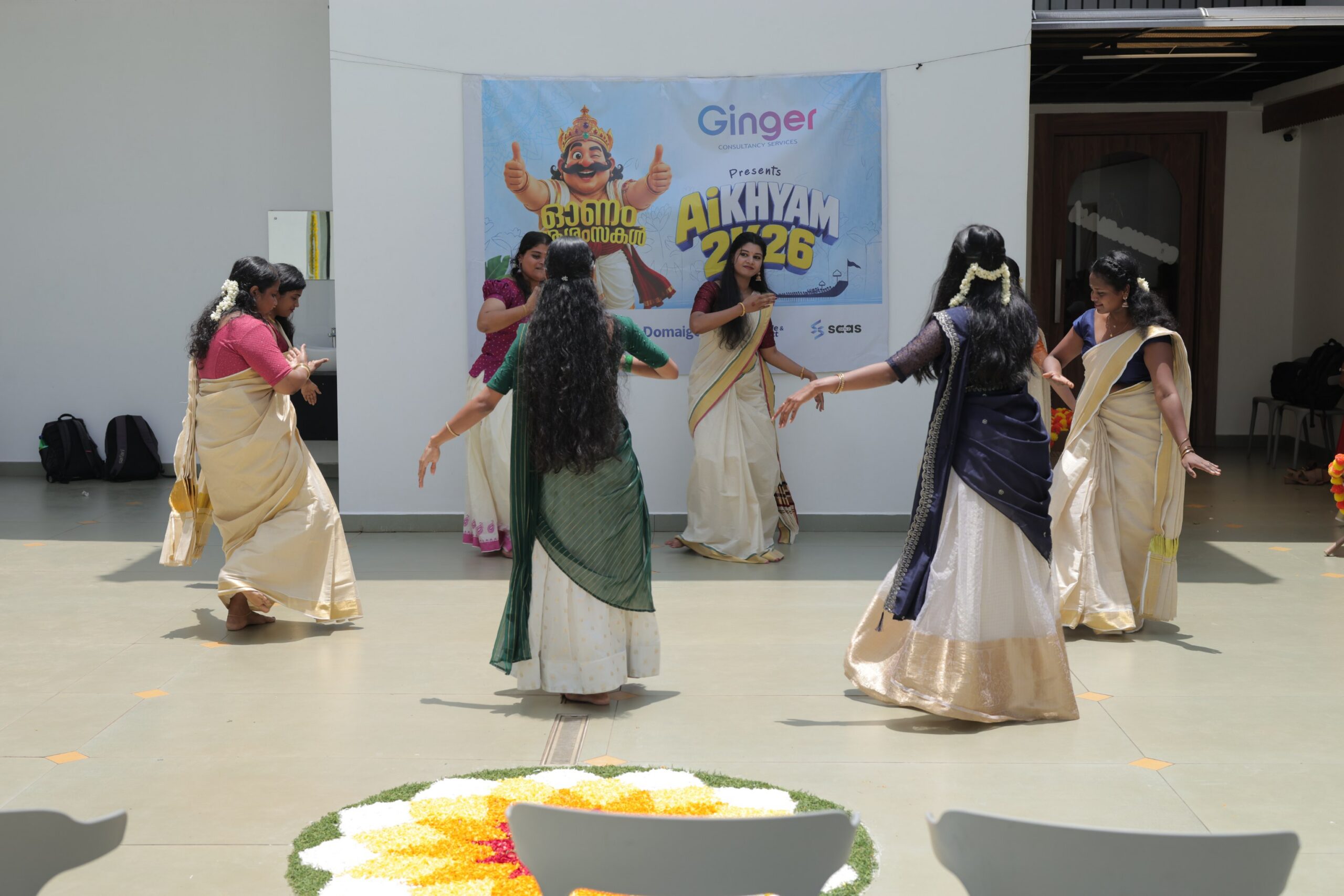 Pookalam and traditional Onam decorations at the venue